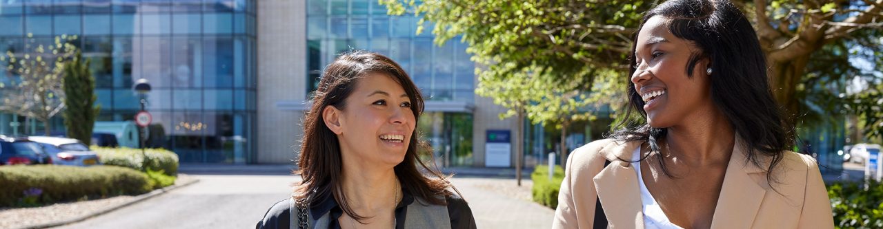 Two Enterprise Mobility team members outside the head office in Egham, UK